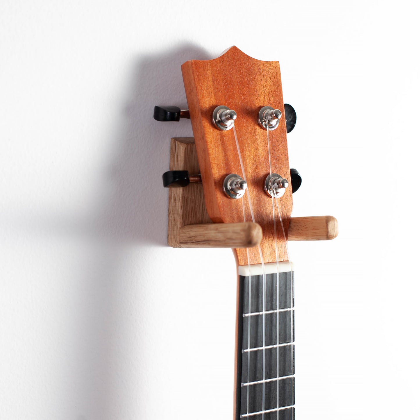 Ukulele wall mount made of solid oak wood